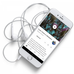 white phone with white headphones showing a meditation app